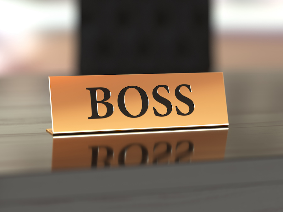A CEO's "boss" nameplate on her desk.