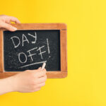 Day off written on a chalkboard as feature image for how to call out of work