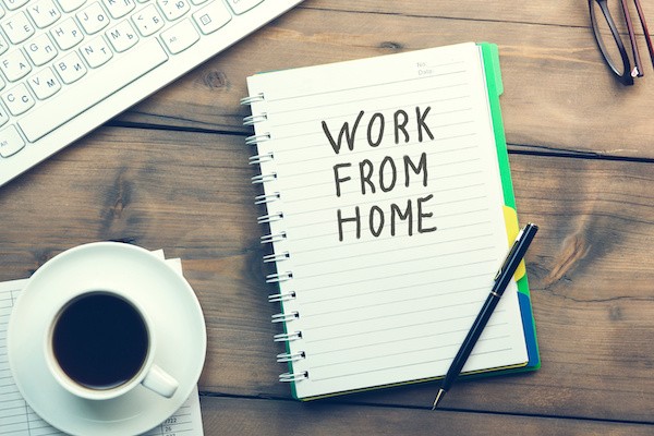 work from home on notepad in front of a computer to introduce 30 ways to make money from home