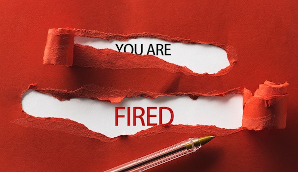 a photo of red torn paper saying you are fired
