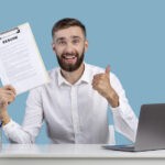 recruiter holding a clipboard with a resume