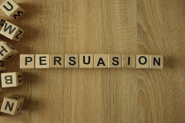 The word ‘Persuasion; on scrabble tiles